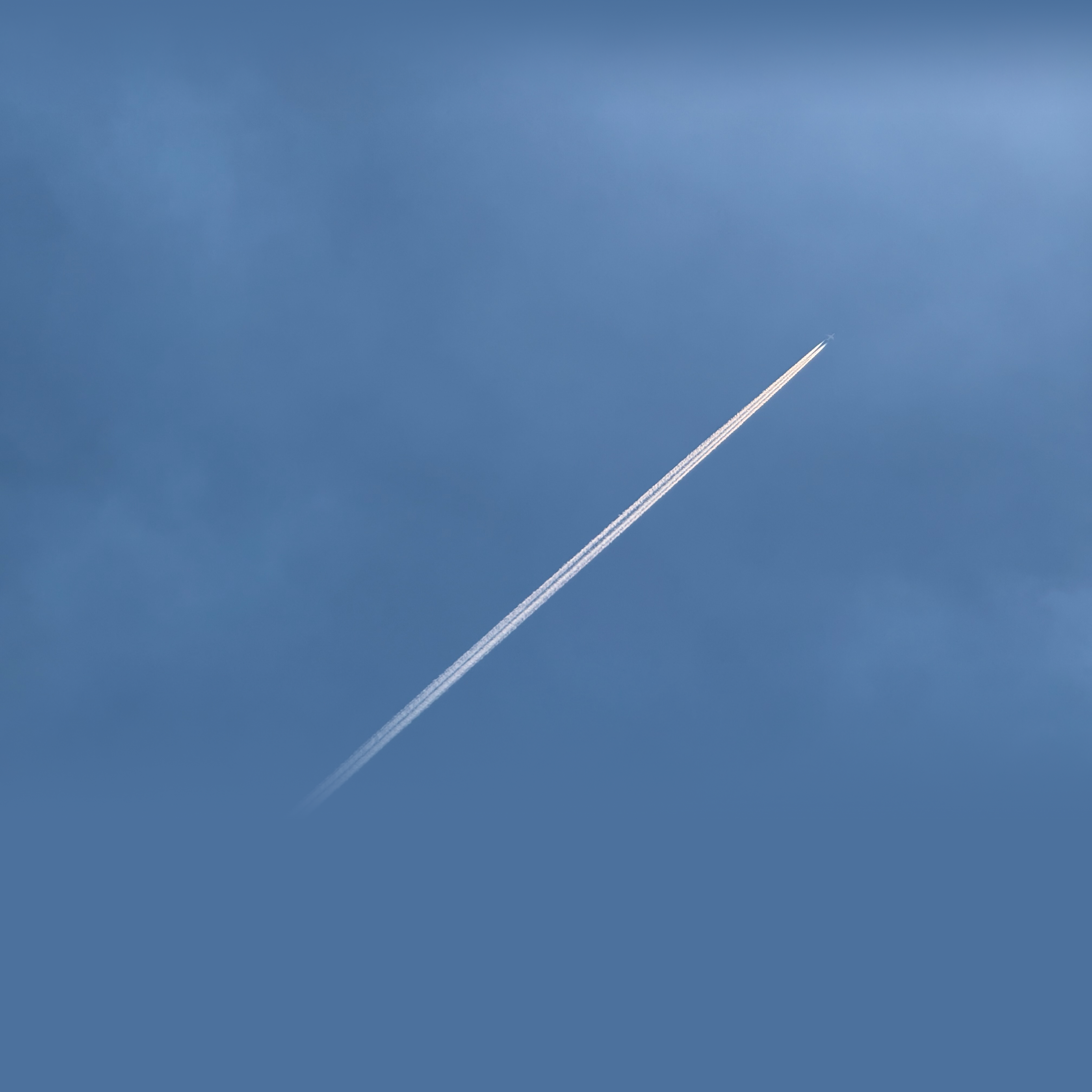 Infinity pool overlooking the sea and a hazy skyline.